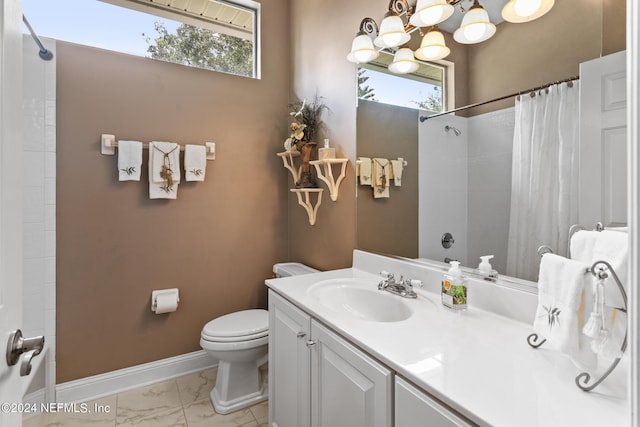 bathroom featuring a shower with curtain, a wealth of natural light, vanity, and toilet