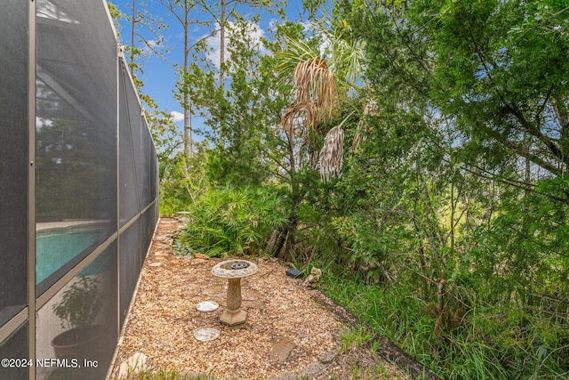 view of yard featuring a lanai