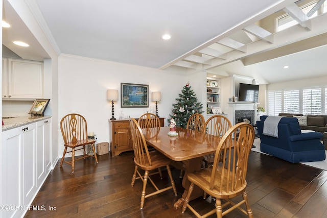 dining space with built in shelves, lofted ceiling with beams, ornamental molding, and dark wood-type flooring