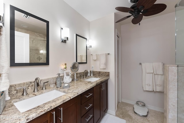 bathroom with tile patterned floors, ceiling fan, and vanity