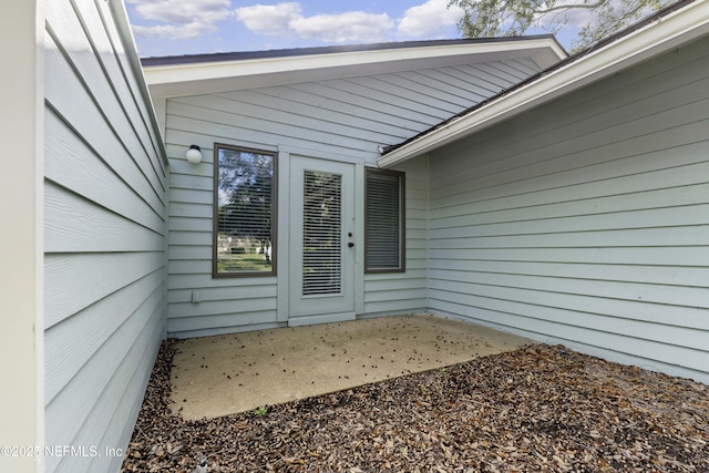 entrance to property with a patio area