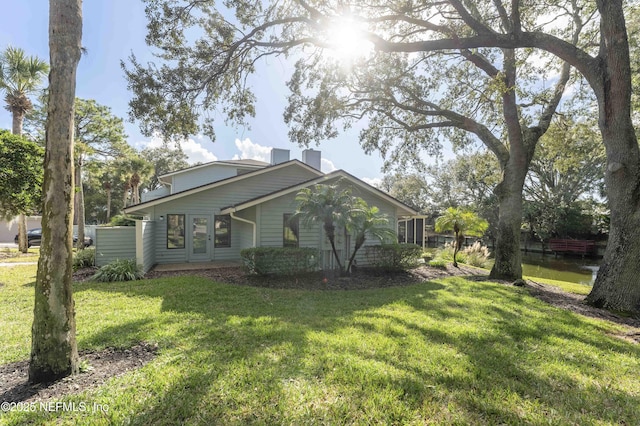 view of home's exterior with a yard