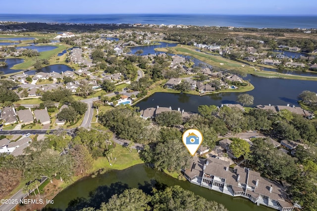 drone / aerial view with a water view