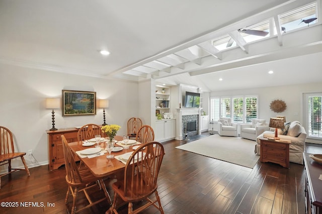 43 Little Bay Harbor Dr, Ponte Vedra Beach, FL 32082 - dining space with dark wood finished floors, a skylight, a fireplace with flush hearth, baseboards, and recessed lighting
