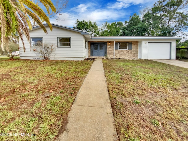 ranch-style house with a front yard and a garage