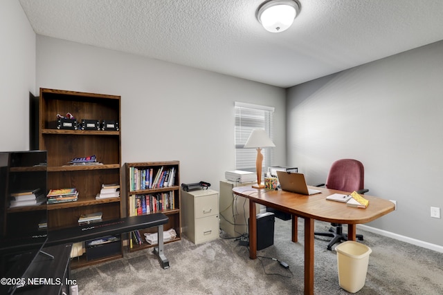 office area with a textured ceiling and carpet floors