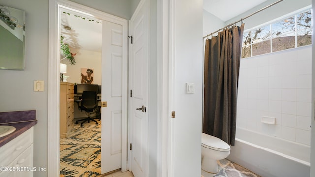 full bathroom with vanity, toilet, and shower / tub combo