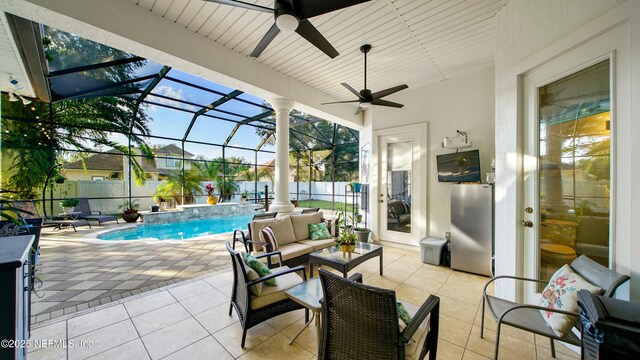 view of patio featuring outdoor lounge area, a fenced in pool, pool water feature, ceiling fan, and a lanai