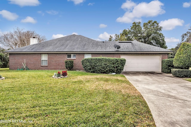 view of front of home with a garage and a front lawn