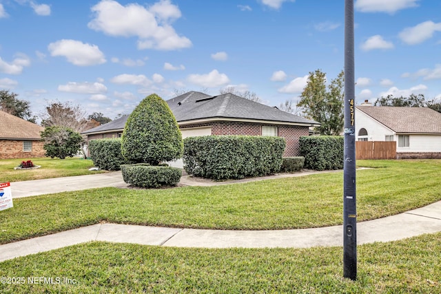 view of side of property featuring a yard