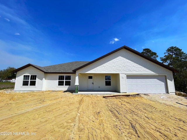 ranch-style home with a garage