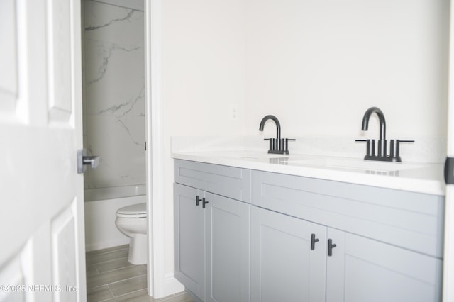 16521 SW 31st Ter, Ocala, FL 34473 - bathroom featuring toilet, vanity, and a shower