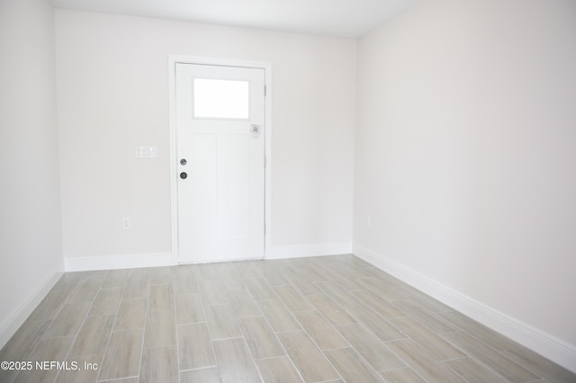 16521 SW 31st Ter, Ocala, FL 34473 - unfurnished room featuring baseboards and light wood-style floors