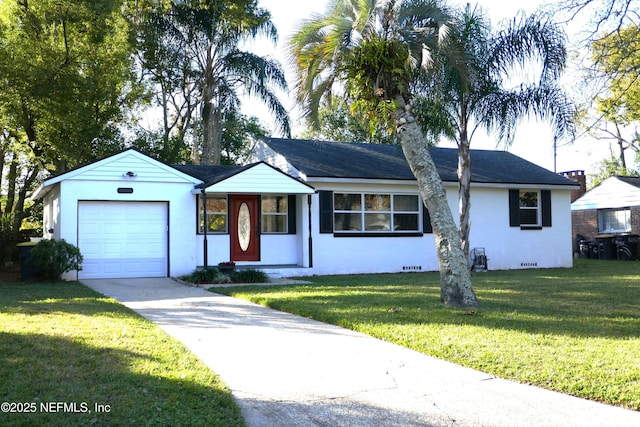 single story home with a garage and a front lawn