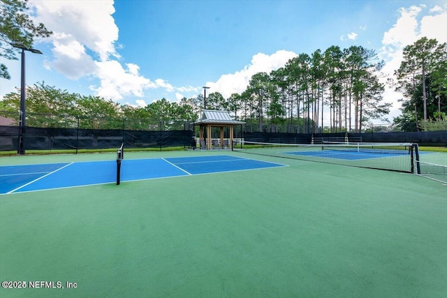 view of sport court featuring a gazebo and basketball court