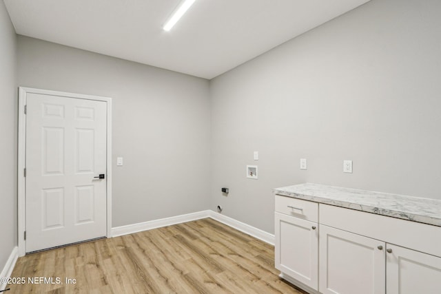 clothes washing area featuring light wood-type flooring, cabinets, hookup for a washing machine, and hookup for an electric dryer