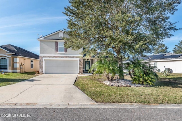 view of front of home with a garage and a front lawn