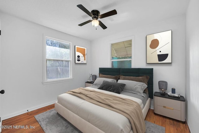 bedroom featuring ceiling fan and wood-type flooring