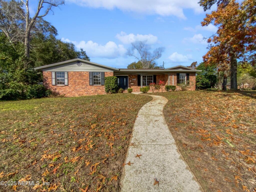 10777 Executive Dr, Jacksonville, FL 32225 - ranch-style home with a front lawn
