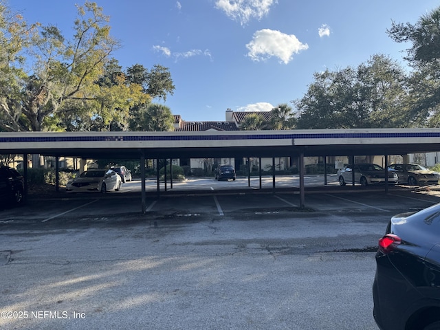 view of vehicle parking featuring a carport