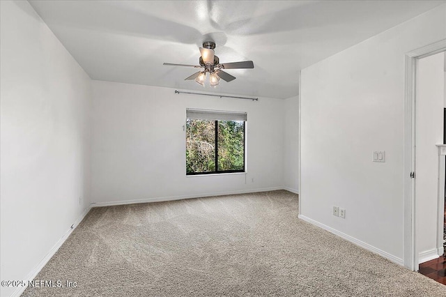 carpeted empty room with ceiling fan