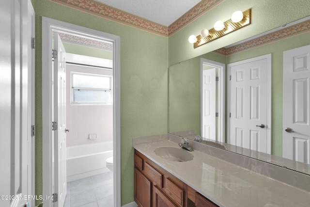 bathroom with tile patterned flooring, vanity, a bath, and toilet