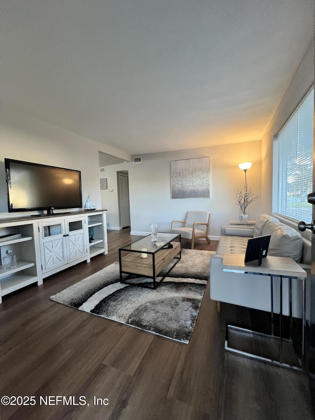 living room featuring dark hardwood / wood-style floors