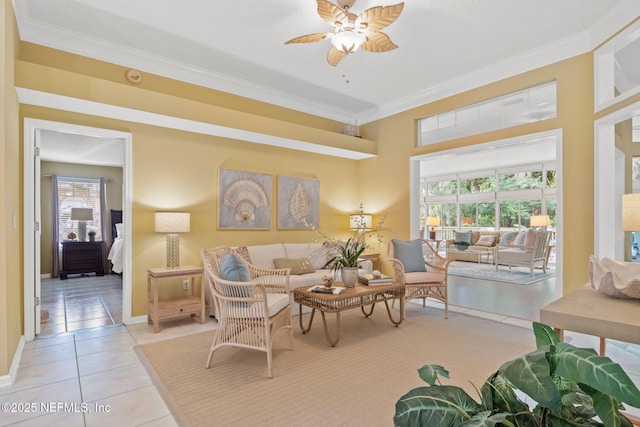 tiled living room featuring a wealth of natural light, ceiling fan, and crown molding