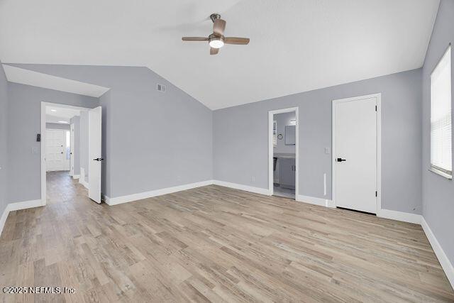 interior space featuring ceiling fan, lofted ceiling, and light hardwood / wood-style floors