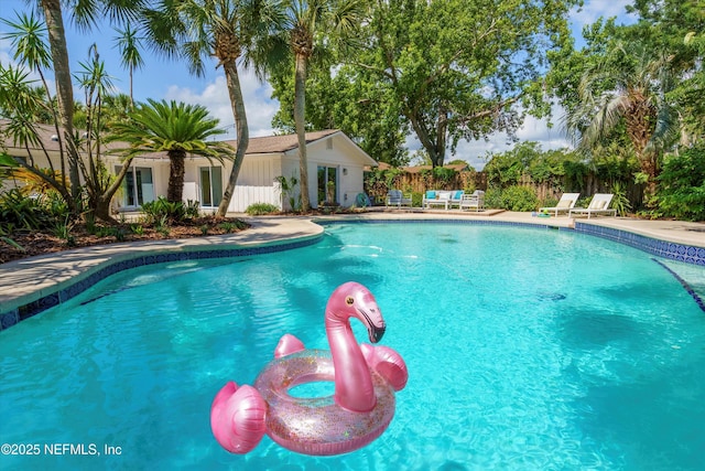 view of swimming pool with a patio