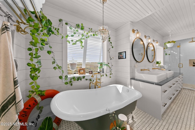 bathroom with wood walls, separate shower and tub, a chandelier, and vanity