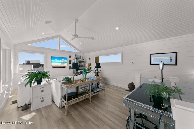 living room featuring vaulted ceiling, light wood-type flooring, ceiling fan, and wooden ceiling