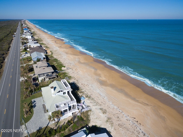 aerial view with a beach view and a water view