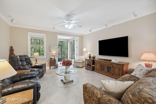 living room featuring ceiling fan and crown molding