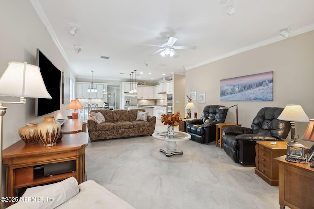 living room featuring ceiling fan and ornamental molding