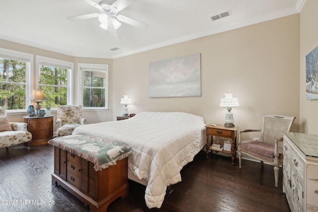 bedroom featuring ceiling fan, dark wood-type flooring, and ornamental molding