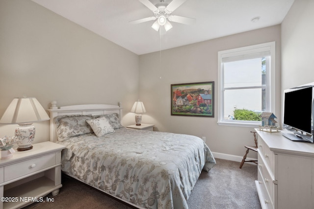 carpeted bedroom featuring multiple windows and ceiling fan