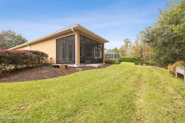 view of yard with a sunroom