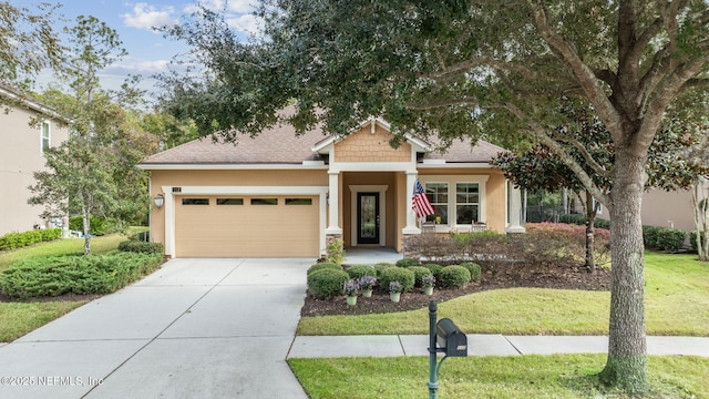 view of front of house with a garage and a front lawn