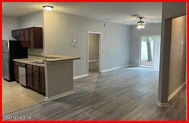 kitchen with ceiling fan, light hardwood / wood-style floors, and appliances with stainless steel finishes