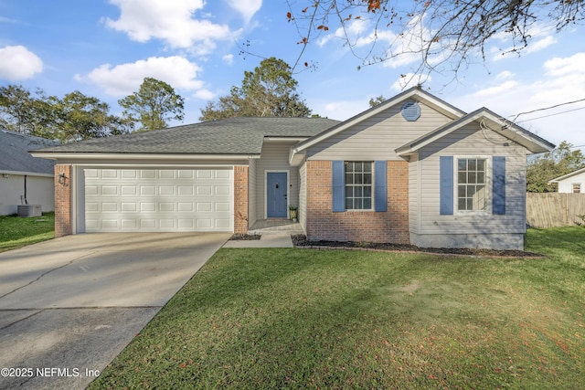 ranch-style house featuring a garage, a front yard, and central AC