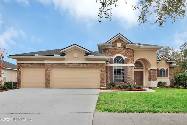 view of front of house featuring a front yard and a garage