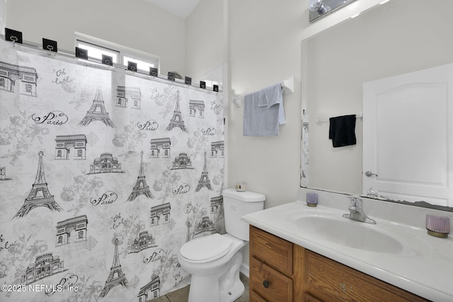 bathroom with tile patterned floors, a shower with curtain, vanity, and toilet