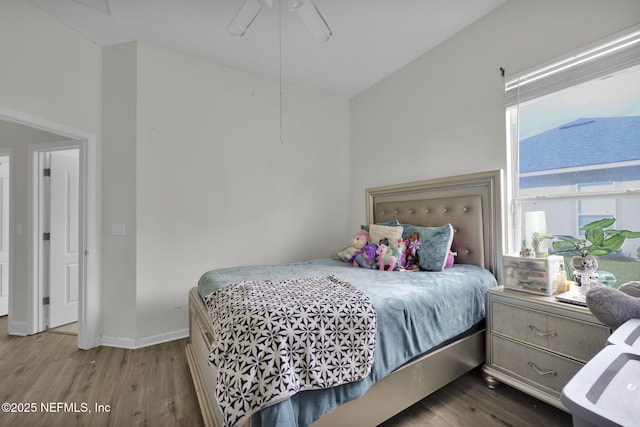 bedroom featuring hardwood / wood-style floors and ceiling fan