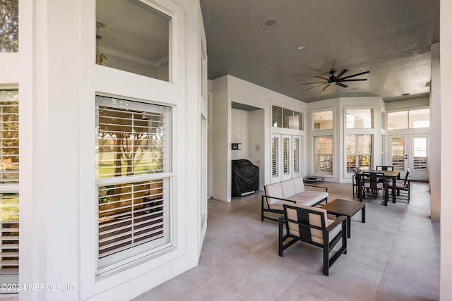 living room with wine cooler, ceiling fan, and crown molding