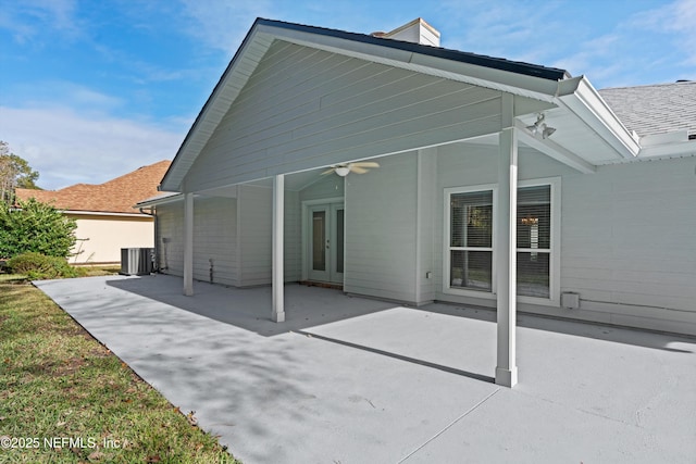 back of house with french doors, cooling unit, ceiling fan, and a patio area