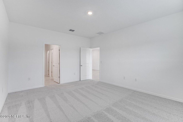 unfurnished bedroom with light carpet