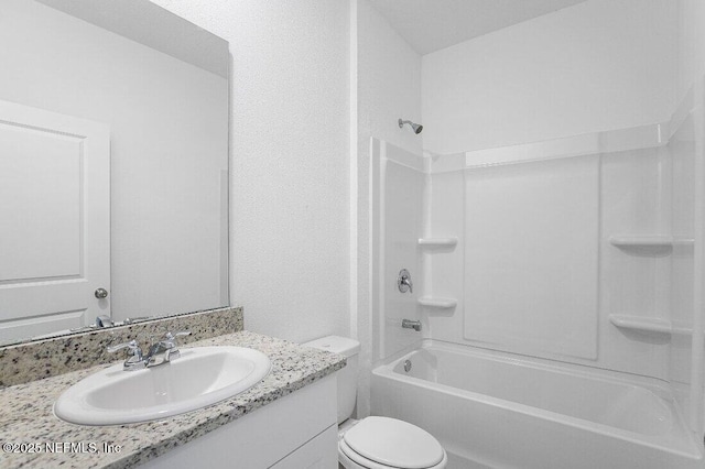 full bathroom with shower / tub combination, vanity, and toilet