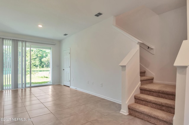 empty room with light tile patterned flooring