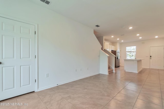 view of tiled spare room